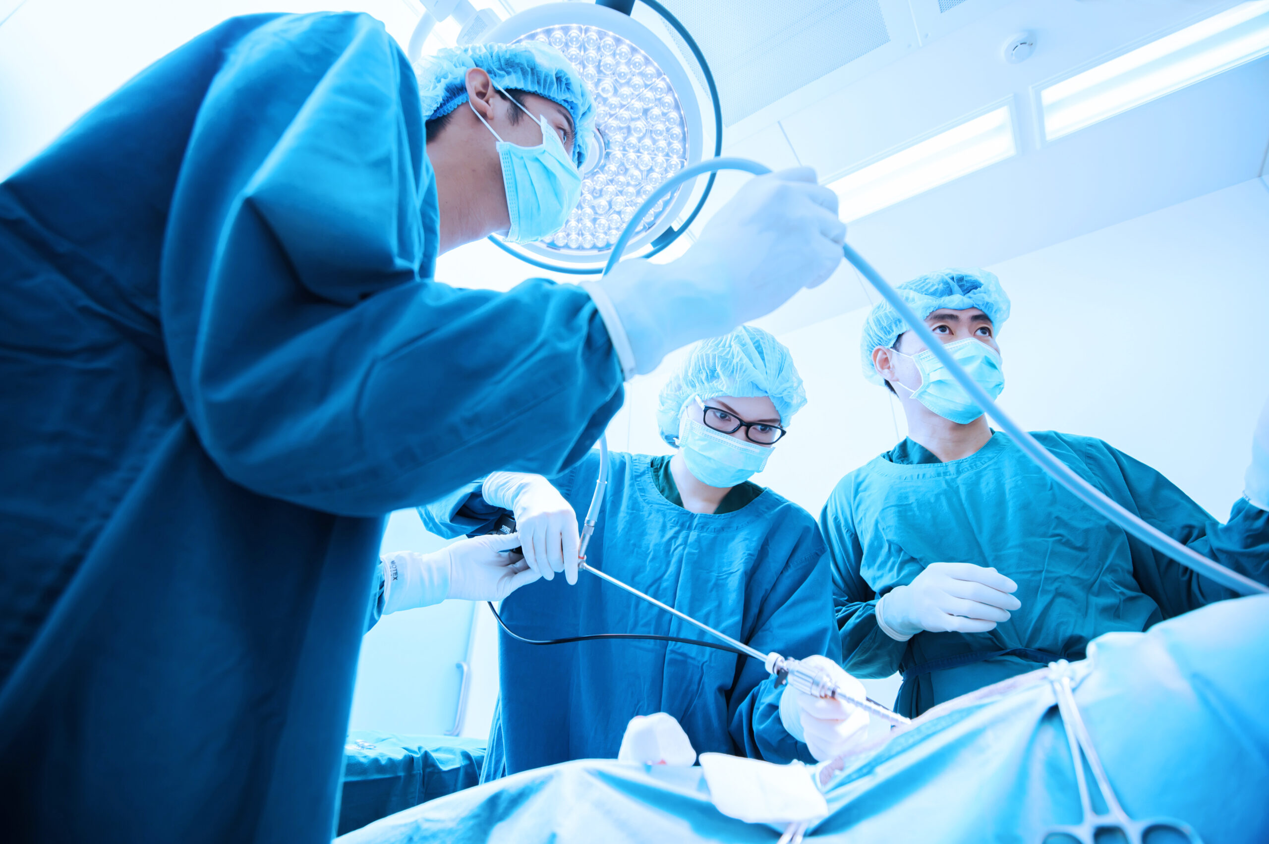 An interventional radiology nurse assists with a procedure.