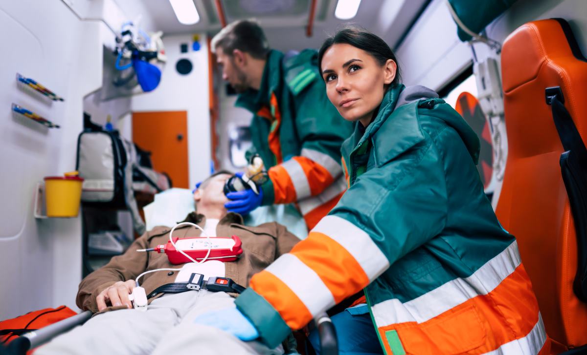 Flight nurse transporting patient
