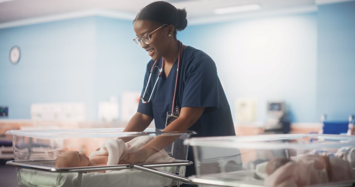 NICU nurse caring for newborn