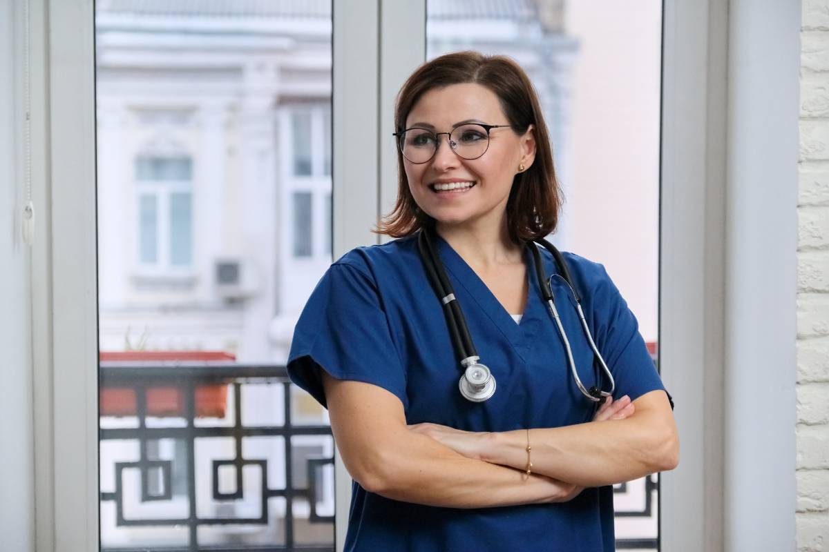 A clinical nurse specialist with AGCNS-BC certification poses for a photo.