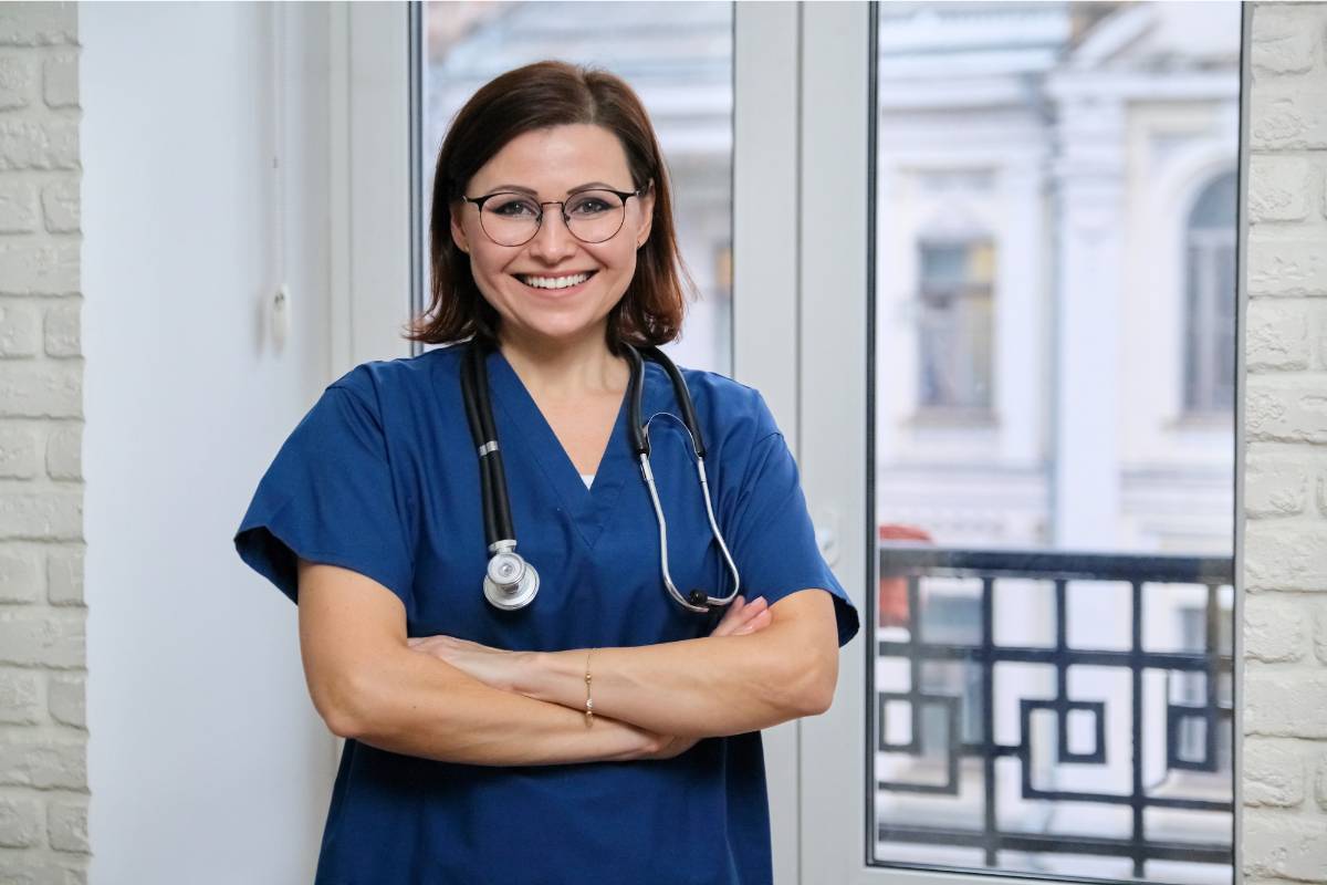 A nursing professional poses for a photo while discussing Arizona nurse burnout resources.