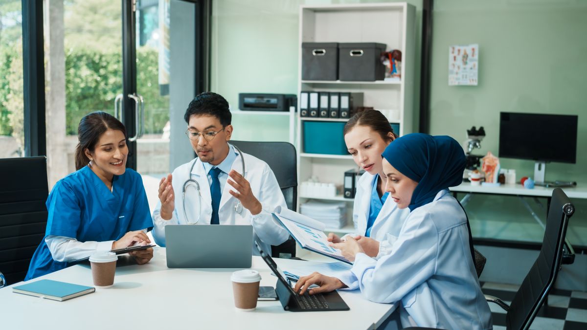 A team of healthcare providers engages in a care coordination session.