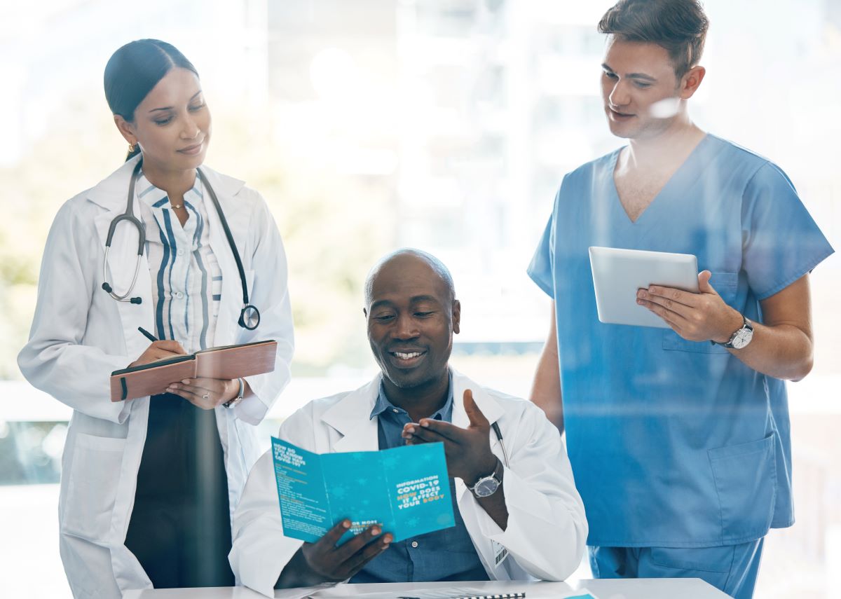A medical facility's CEO meets with managers.