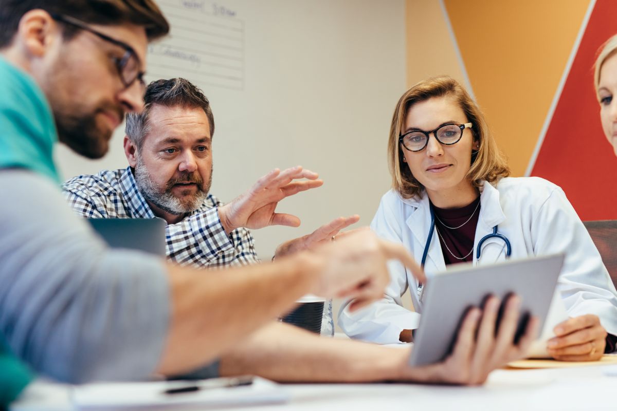 Image of healthcare professionals engaged in a change management meeting