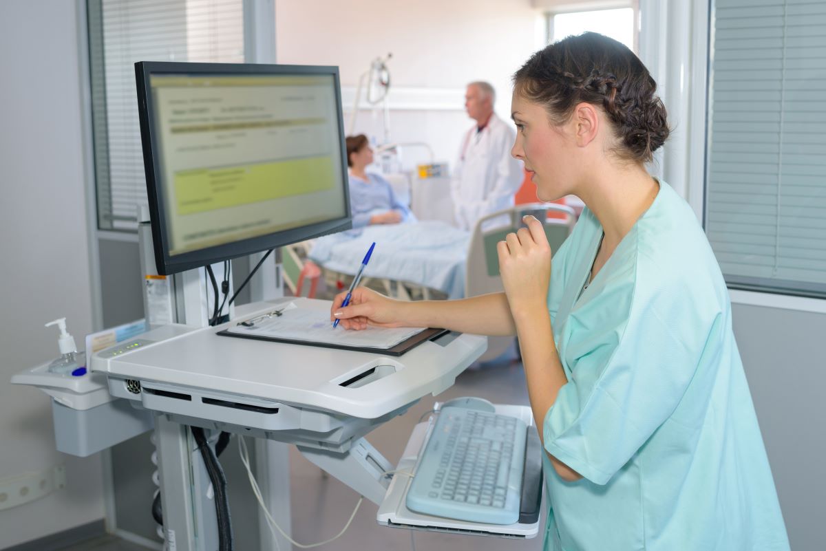 A healthcare worker figures out a patient's coordination of benefits for billing purposes.