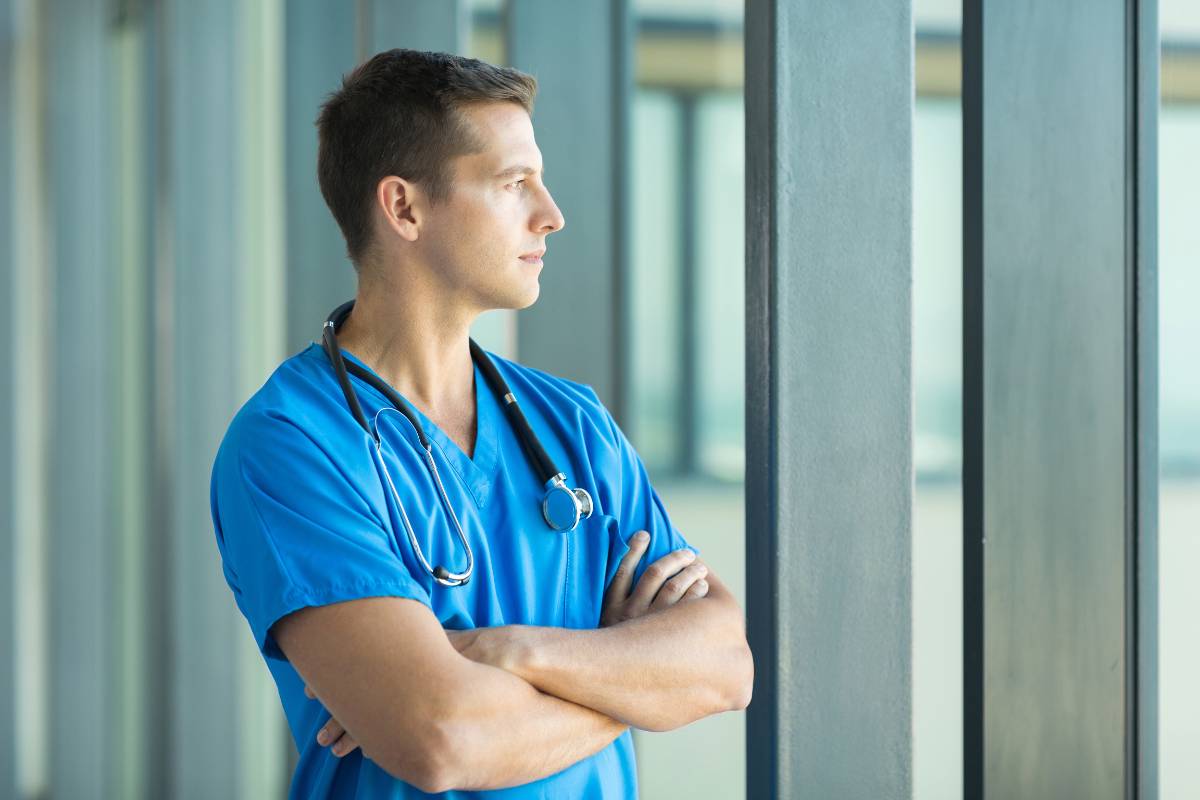 A man uses critical thinking in nursing.