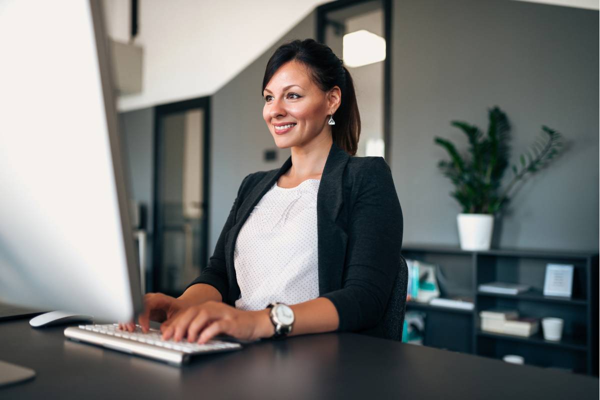 A woman works on her director of nursing cover letter.