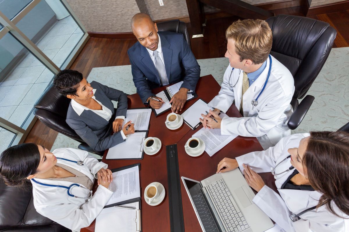 Hospital executives meet for a breakfast meeting.