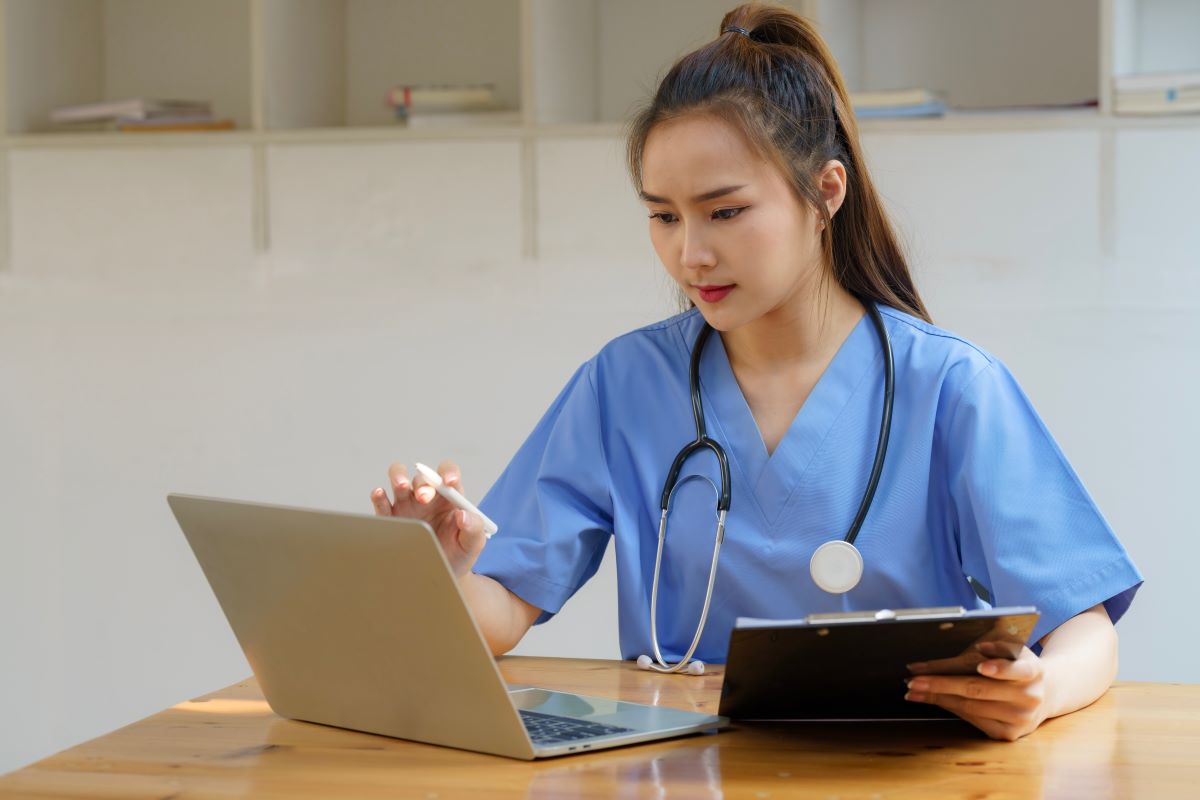 A hiring manager prepares healthcare interview questions for candidates.