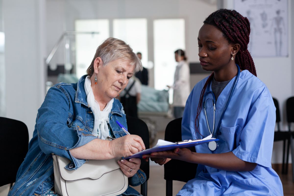 A hospital worker admits a patient.