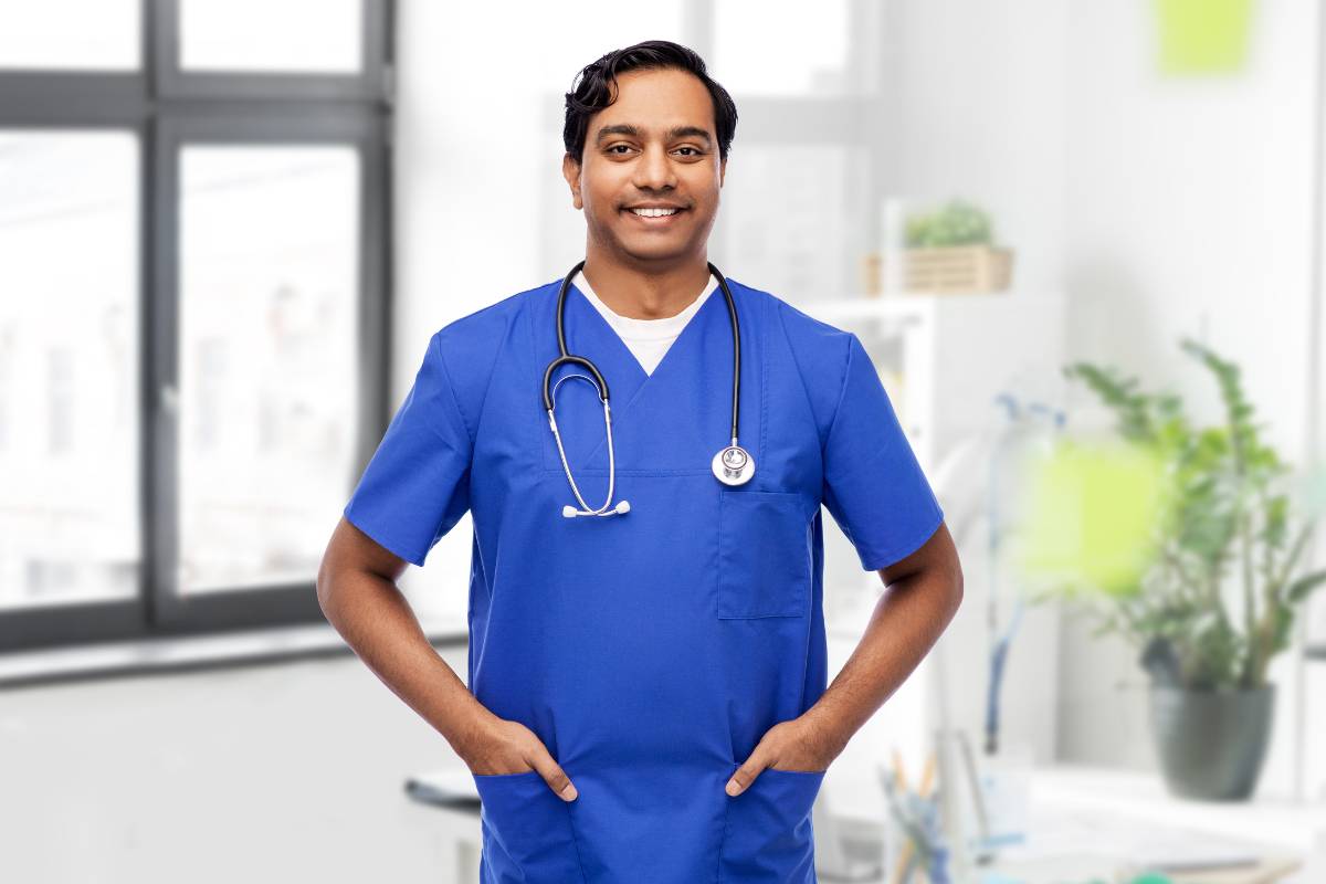 A nurse poses for a picture while discussing how to become an RN in California.