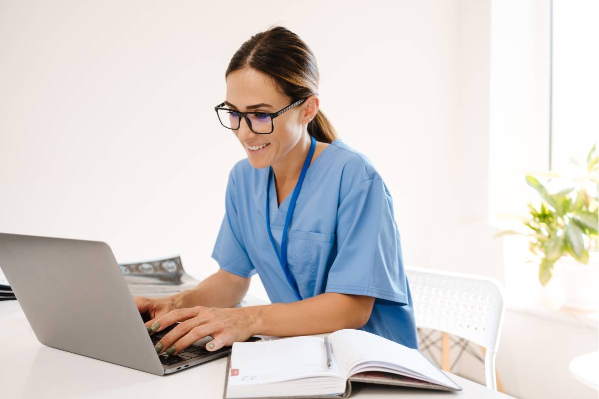 A nurse researches how to become an RN in Louisiana on the computer.