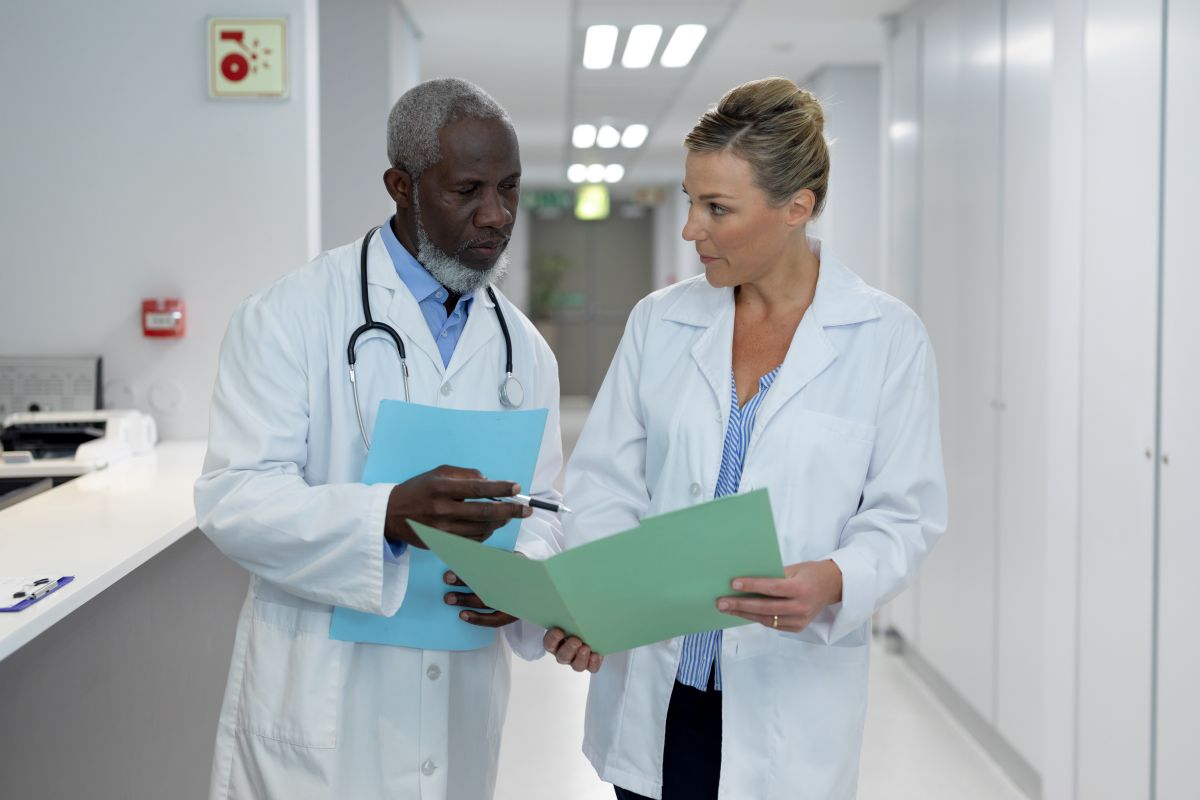 Physicians at an Indiana clinic discuss a patient's chart.