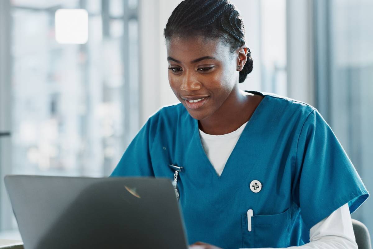 A nurse takes the Legal Nurse Consultant Certification exam on a computer.