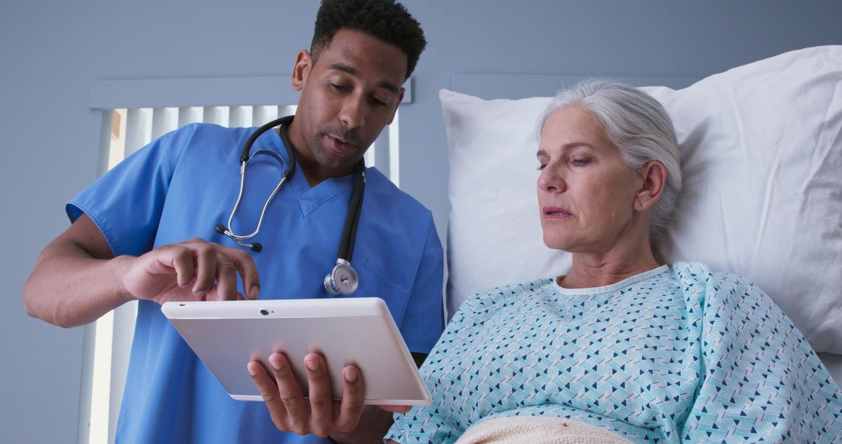 A licensed vocational nurse (LVN) advising a patient.