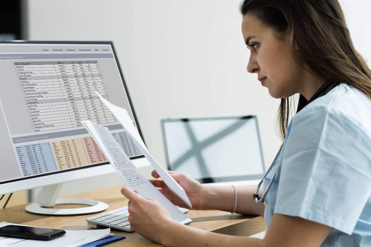 A healthcare worker works on an MDS in nursing homes.