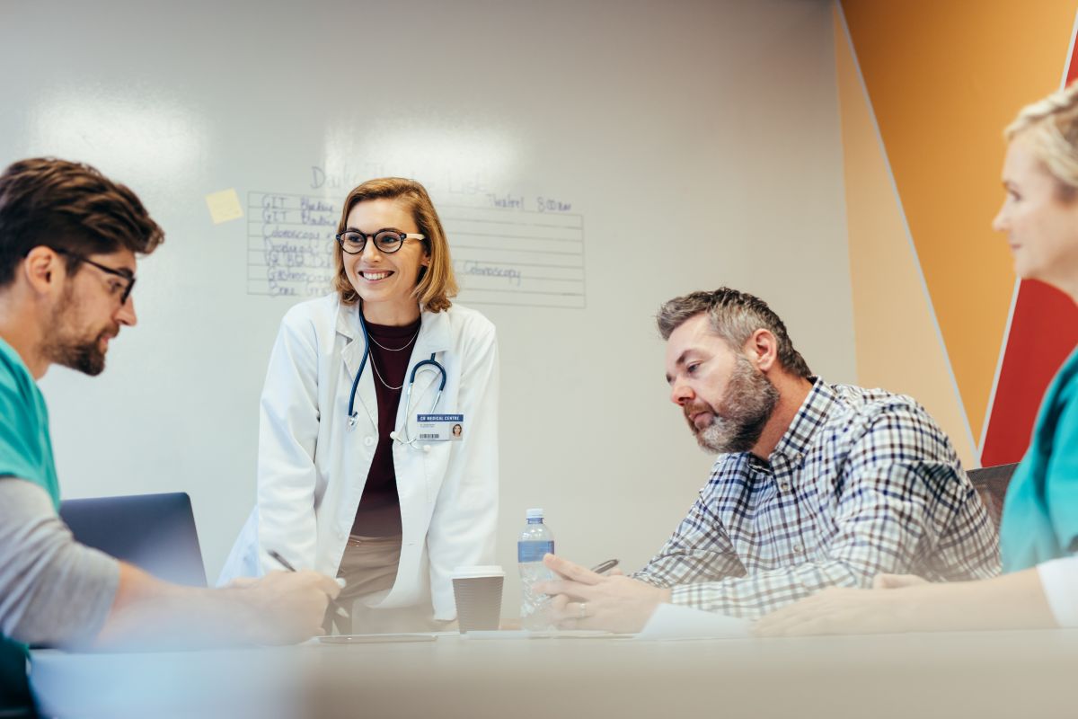 A team of healthcare professionals reviews MEAT criteria as they conduct an audit.