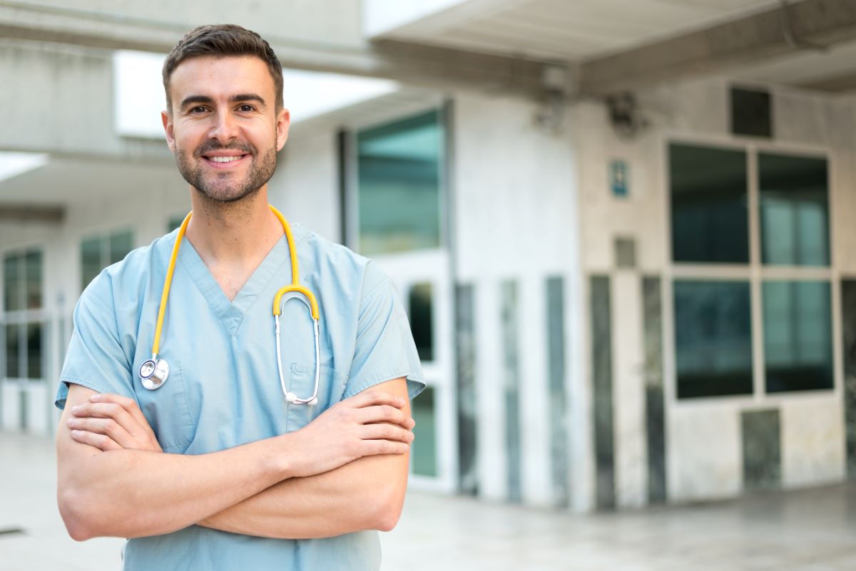 New grad nurse standing with arms crossed