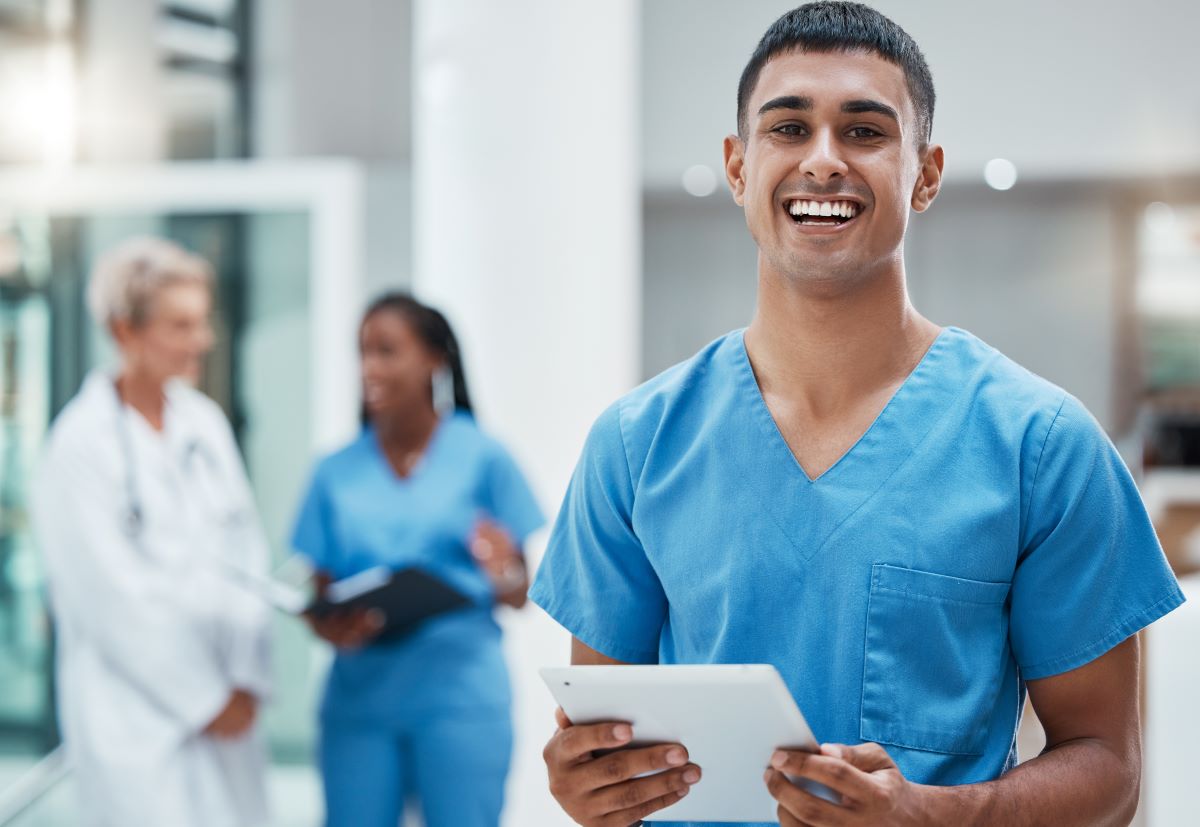 Nurse smiling with tablet
