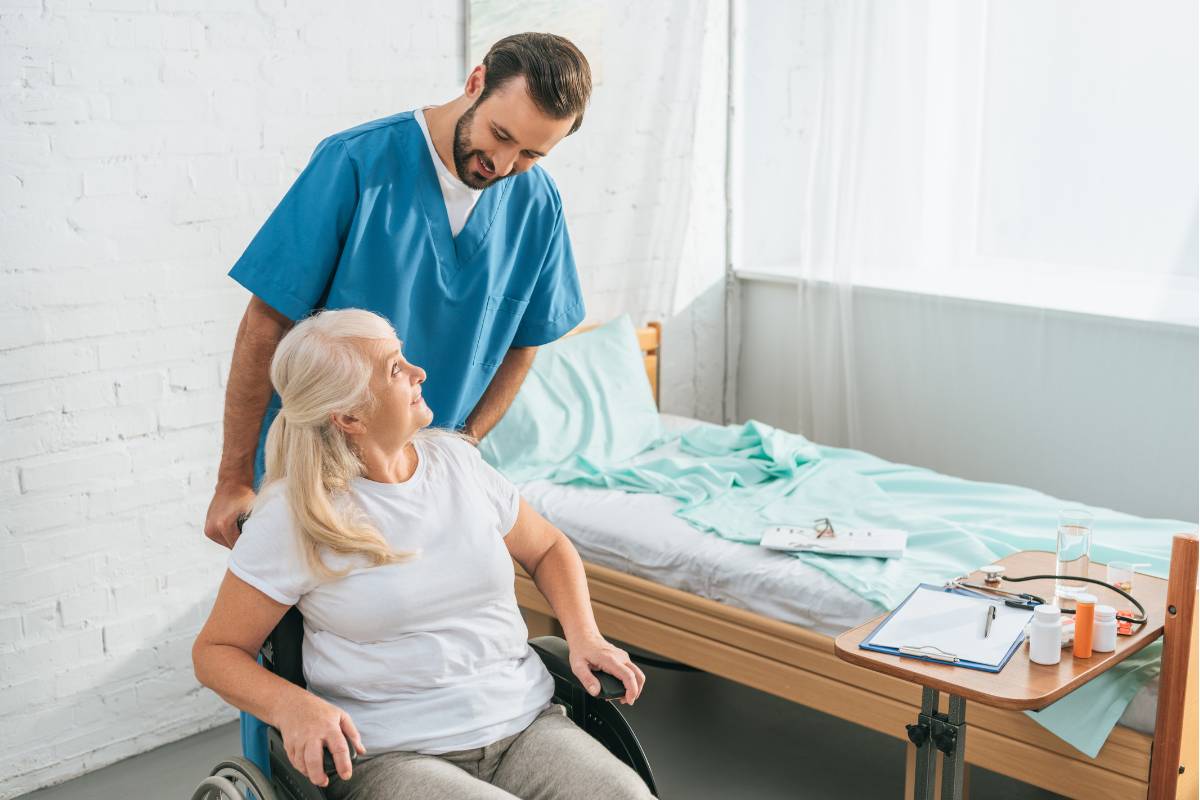 A nurse explains to a patient how they pursued nursing as a second career.