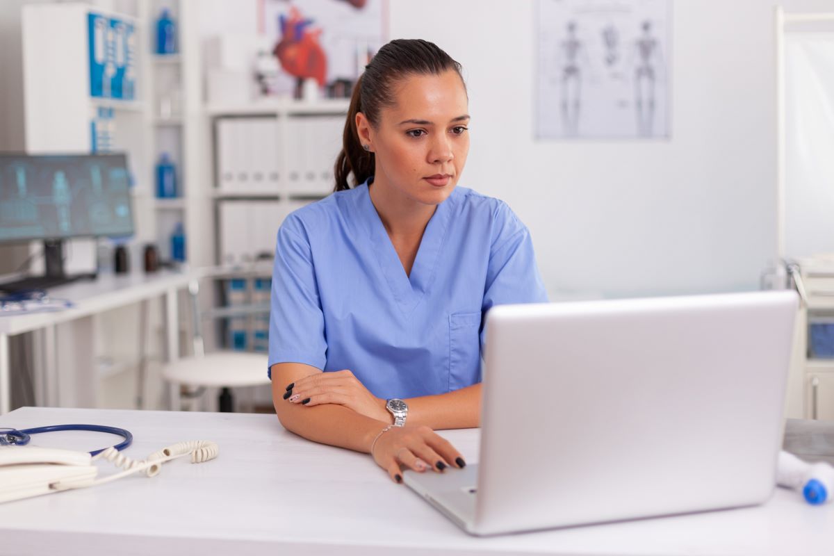 A nurse manager working on some online marketing tactics to help increase the visibility of her facility.