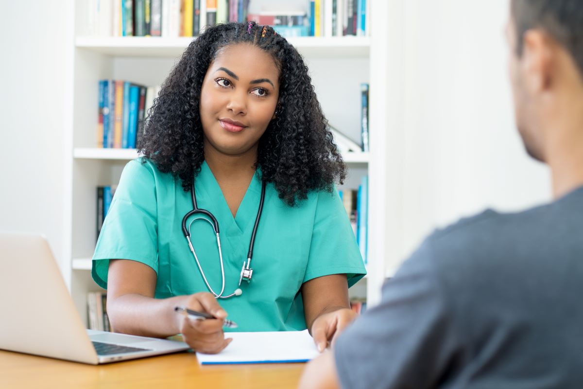 A hiring manager interviewing a candidate for a nursing job, looking for resume red flags.
