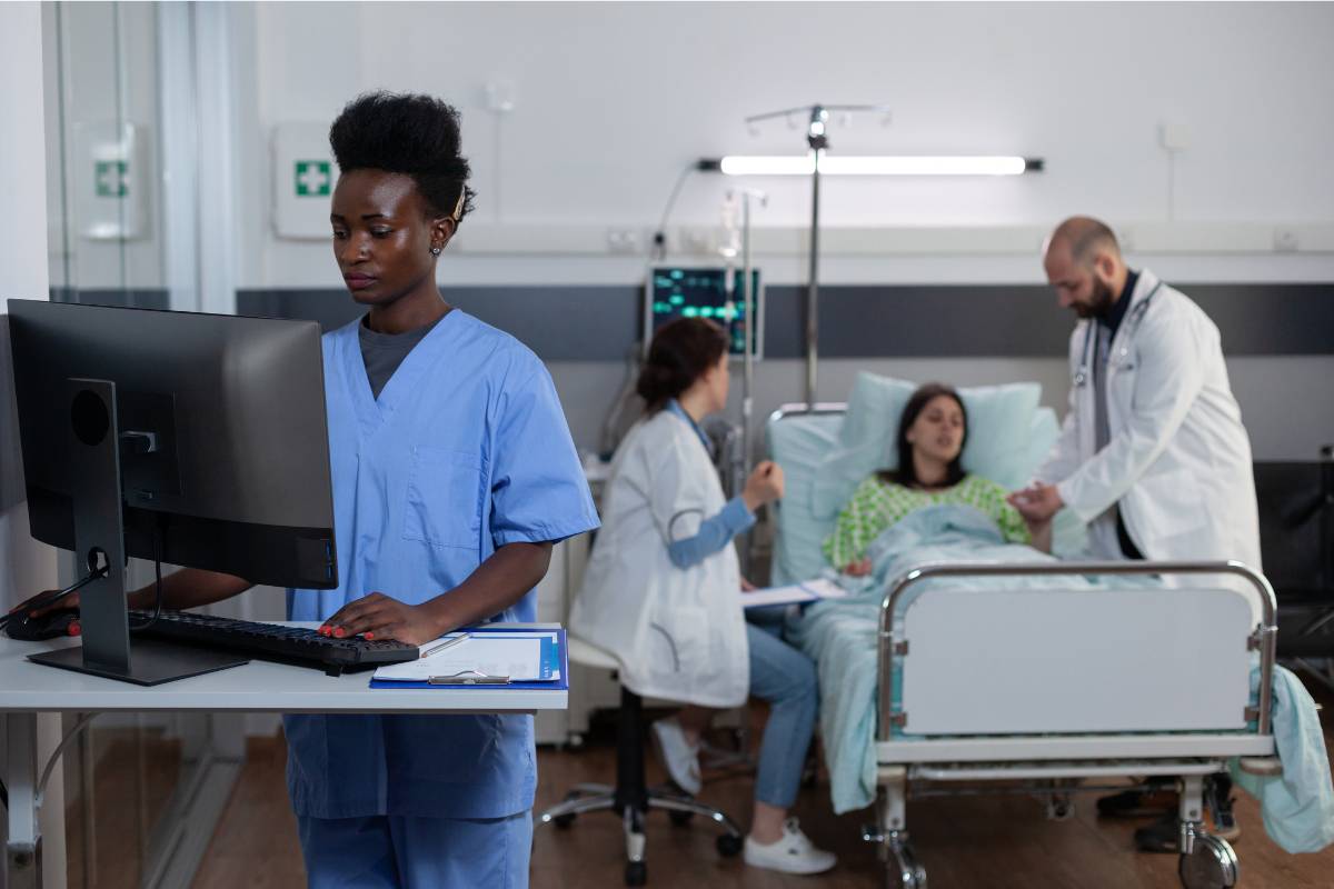 A nurse write SBAR examples, nursing notes, and more in an electronic health record.