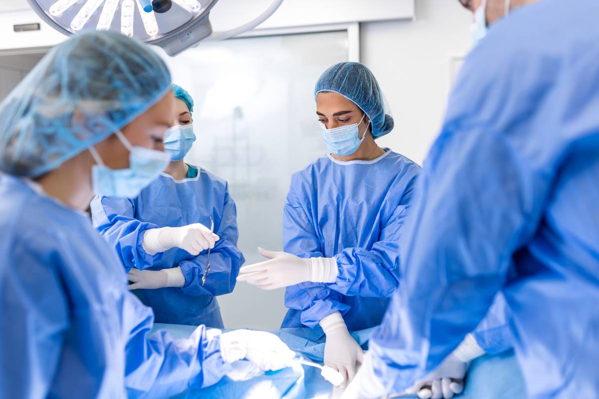 Two nurses demonstrate the difference between a scrub nurse vs. surgical tech.