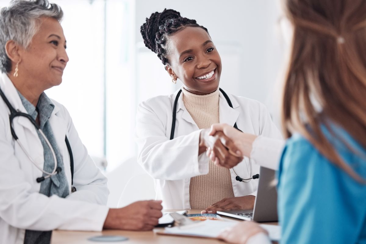 A nurse completes her stay interview with colleagues.
